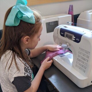 Two first graders contributing to the Elementary class project sewing hand towels in an effort to minimize MSD's footprint! ♻️ #carbonfootprint #montikids